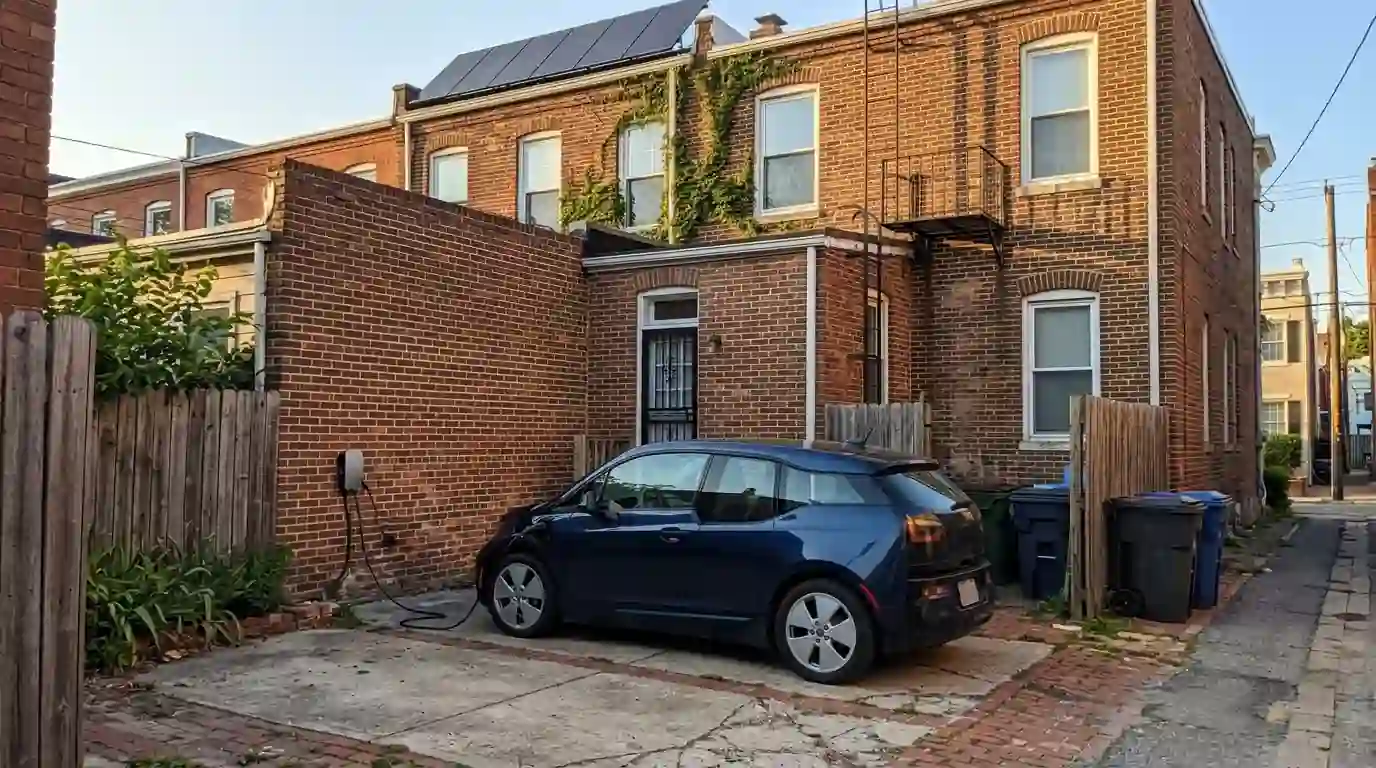 EV charging behind a DC rowhouse with solar